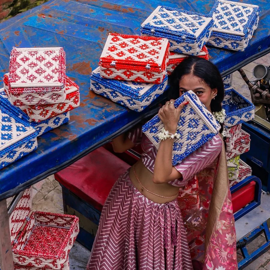 Stacked woven boxes in blue and red geometric patterns