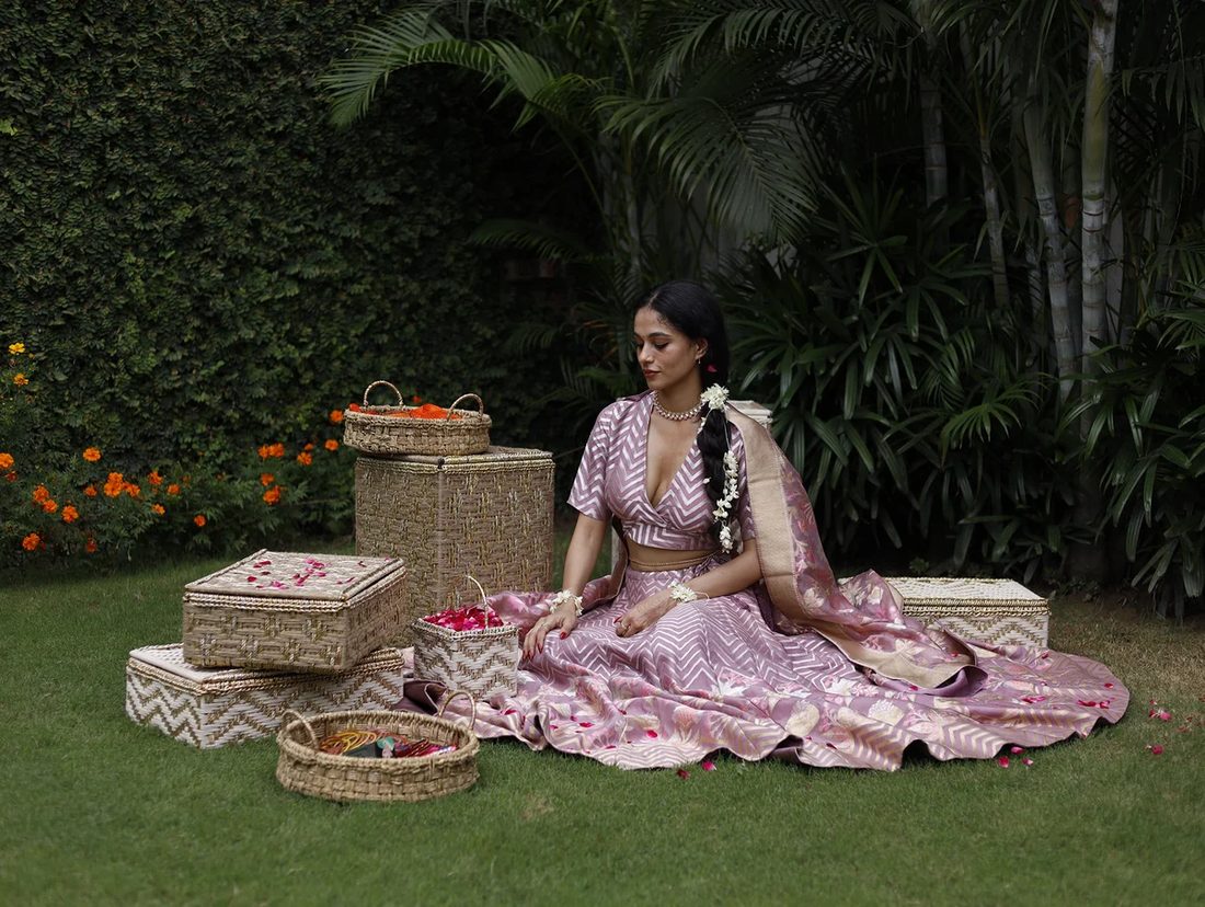 Sirohi handwoven baskets and lidded boxes arranged on a lawn